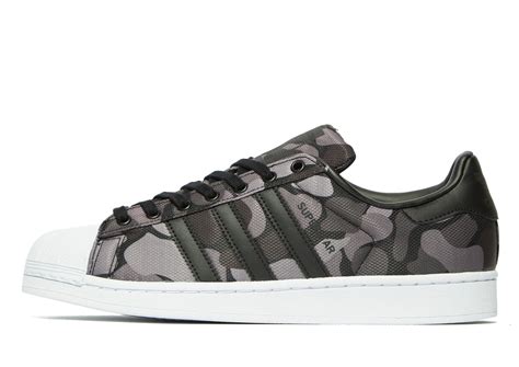 camouflage adidas sneakers.